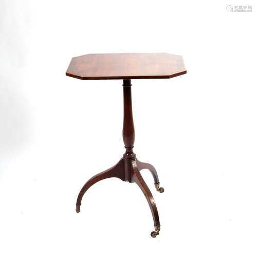 A Regency mahogany lamp table, the canted rectangular top on slender column and tripod base,