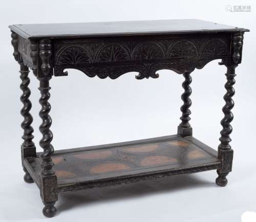 A Victorian ebonised side table, circa 1860, the moulded oblong top above a palmette incised frieze,