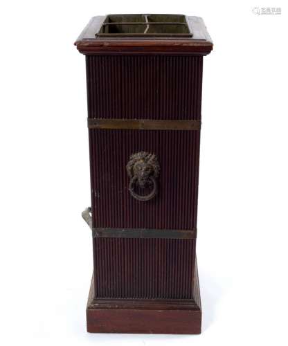 A mahogany stick stand, circa 1900, with reeded sides and brass bands,