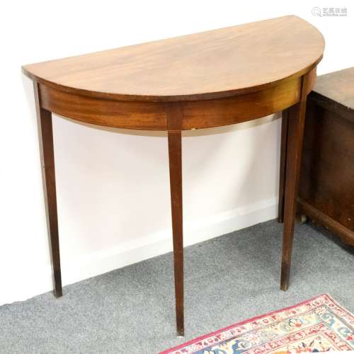 A semi-elliptical side table, circa 1790, on square tapering legs,