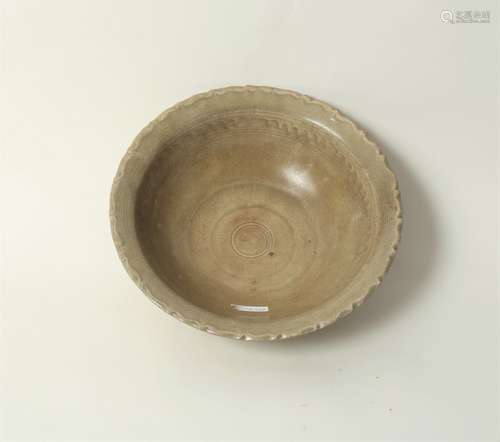 A Chinese celadon bowl, Yuan dynasty, with moulded wavy rim, 27.