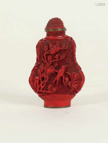 A Chinese cinnabar lacquer snuff bottle and stopper, decorated birds on flowering branches, 7.