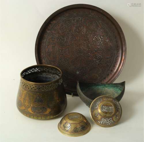 A group of Islamic metal wares including two circular bowls, incense boat,