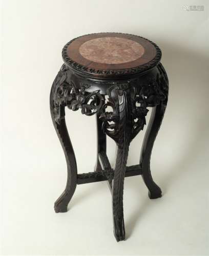 A Chinese 19th Century hardwood jardinière stand with inset marble top,