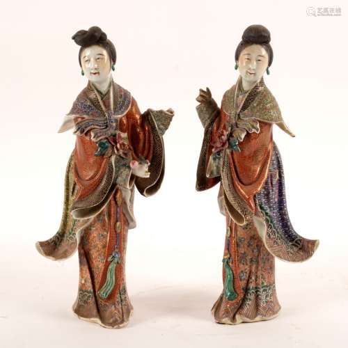 A pair of Chinese porcelain figures of bijin (beauties) in famille rose enamelled coats,