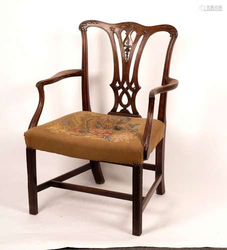 A George III mahogany armchair of Chippendale design with carved serpentine top rail and pierced