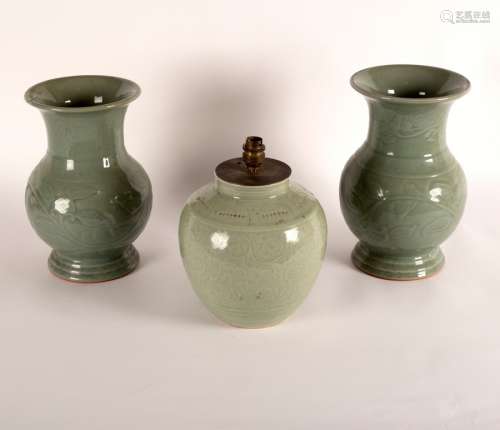 A near pair of Chinese celadon baluster vases, 31cm high and an ovoid celadon vase, 22.