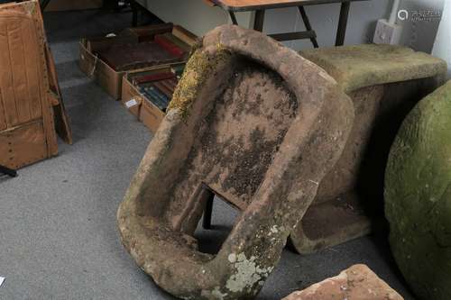 A D-shaped stone trough,