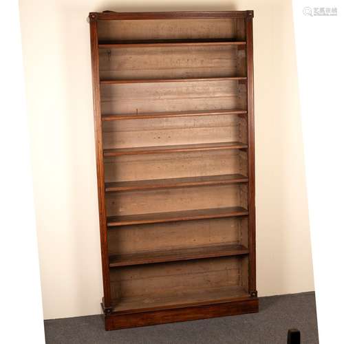 A Regency mahogany bookcase, with reeded sides and roundels to corners, adjustable shelves,