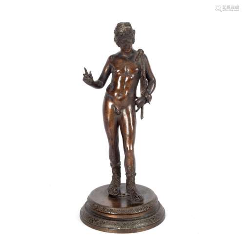 A bronze figure of a Narcissus, after the Antique, raised on a circular base,