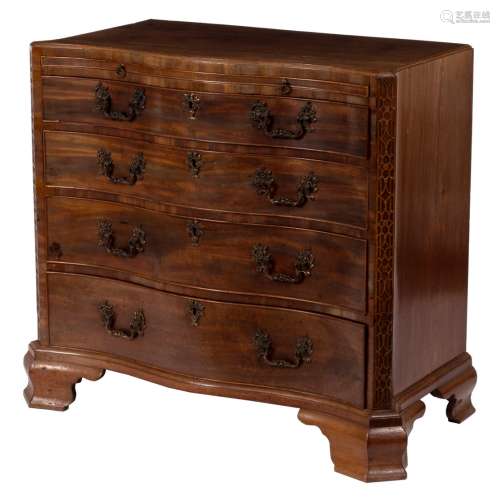 A George III mahogany serpentine chest, fitted a brushing slide above four long graduated drawers,