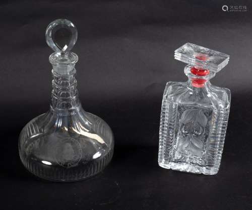 A 19th Century ring neck ship's decanter with armorial crest and bullseye stopper, 26.