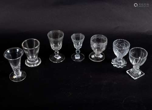 Three Georgian wine glasses of various designs on knopped stems and various cut bases,