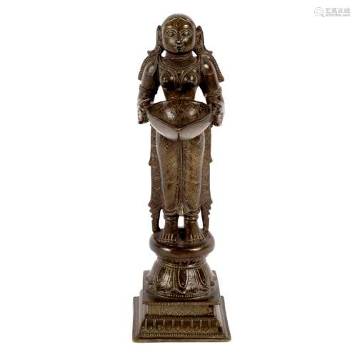 An Indian bronze oil lamp figure, Lakshmi, 19th Century,