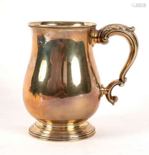 A Victorian silver baluster mug, JW, Exeter 1882, with leaf capped scroll handle, 13.