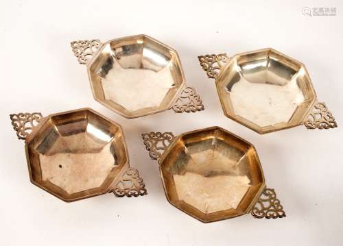 Four silver octagonal sweetmeat dishes, three by Goldsmiths & Silversmiths Company,