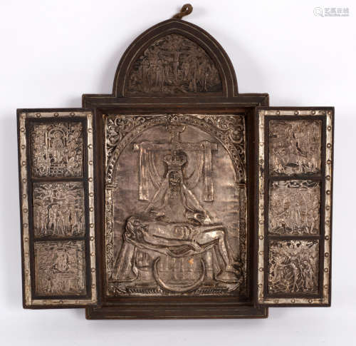 A Greek triptych, circa 1870, embossed in sheet silver with various scenes from the life of Christ,
