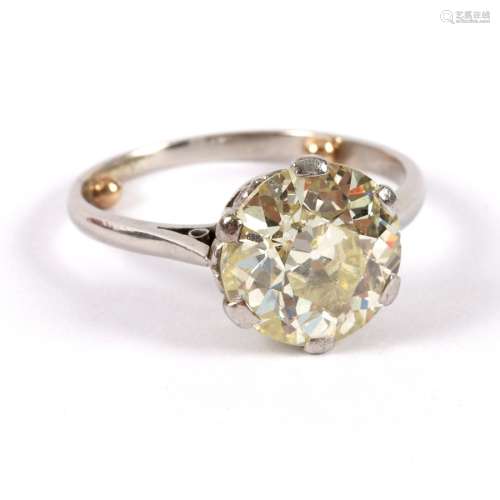 A diamond solitaire ring, claw set to an unmarked white metal shank, the stone approximately 2.