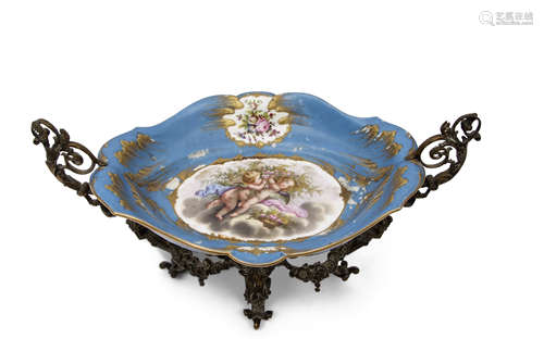 19th century Sevres style centrepiece, the porcelain bowl supported in a gilt scrolling frame, the