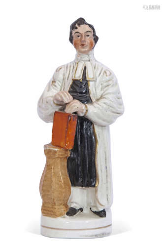 Staffordshire figure of The Rev Thomas Raffles decorated in typical fashion, See Pugh