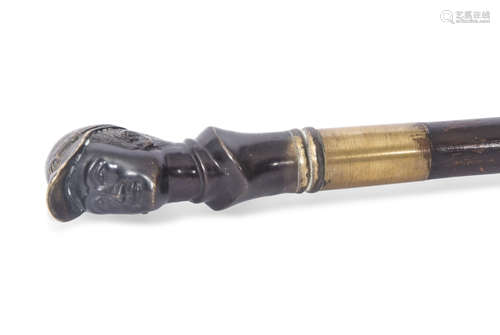 Late 19th/early 20th century walking cane applied with a gilt bronze handle in the form of a