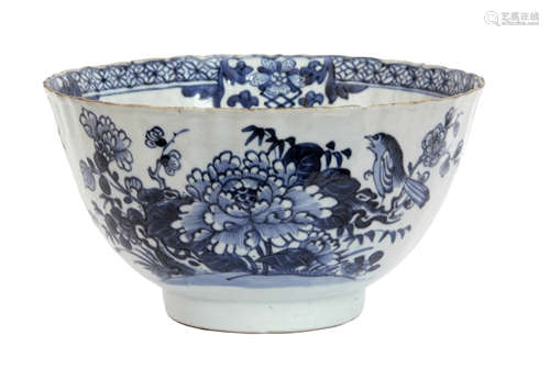 Chinese export porcelain bowl with blue and white decoration of a bird on a branch with floral