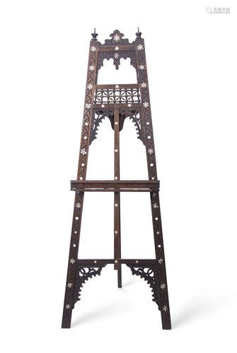 A Moorish easel with carved frieze and mother of pearl detail, 165cm high