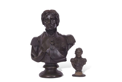 Pair of busts of Vice Admiral Nelson, one raised on a circular foot, the other smaller bust on an