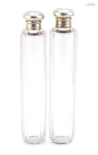 Pair of cut glass bottles with silver lids, each 18.5cm in length : For Condition Reports Please