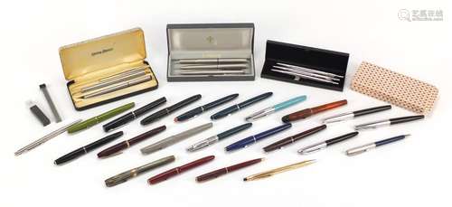 Vintage and later fountain pens, ballpoint pens and propelling pencils including Watermans with 14ct