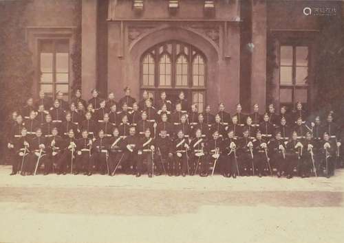 Military interest black and white photograph of a Regiment in full regalia, the front row