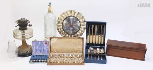 Sundry items including an oil lamp, advertising soda syphon, inlaid box, Smith's clock and cutlery