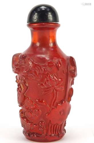 Chinese cherry amber coloured snuff bottle decorated with flowers, 10cm high : For Condition Reports