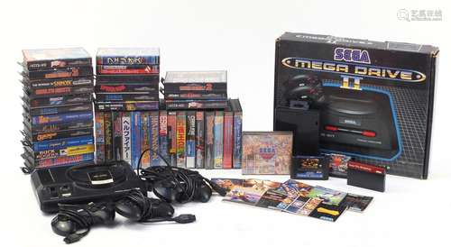 Two Sega Megadrives and a collection of games including Mortal Kombat II, Buck Rogers and Golden Axe