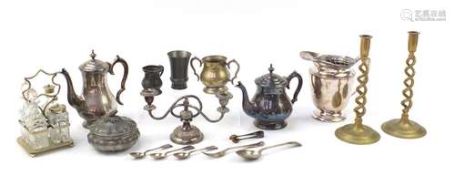 Metalware including a pair of brass candlesticks and silver plated cruet stand with glass bottles,