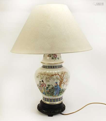 Chinese porcelain vase and cover lamp on carved hardwood base, decorated with flowers and