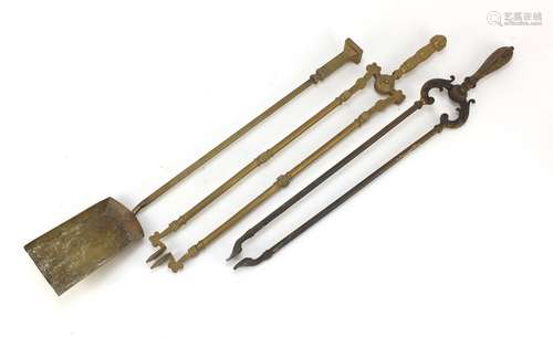 Two pairs of ornate Victorian brass fire tongs and a brass shovel, the largest 69cm in length :