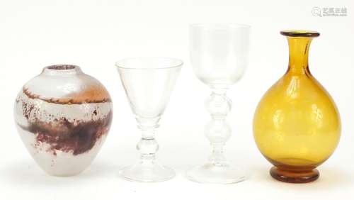 Art Glassware by Liam Carey including two wine glasses with folded foots and knopped stems, the