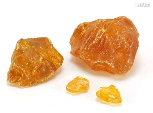 Four blocks of Baltic amber, the largest 12cm wide, 667.0g : For Condition Reports Please Visit