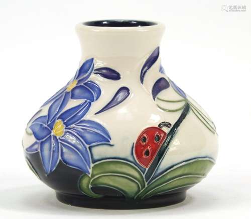 Moorcroft pottery vase hand painted with a ladybird and flowers, dated 2005, 6cm high : For