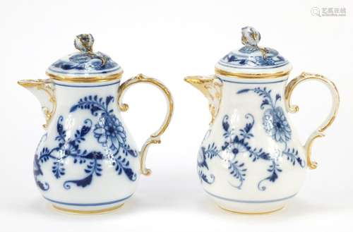 Two Meissen water pots with floral knops, each hand painted in the Blue onion pattern, crossed sword