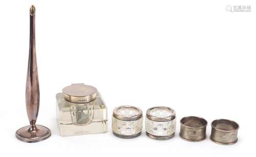 Silver and white metal objects including a silver mounted cut glass inkwell and a pair of hobnail