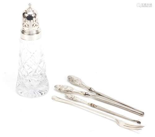 Cut glass sifter with silver lid, silver pickle fork, a pair of glove stretchers and button hook