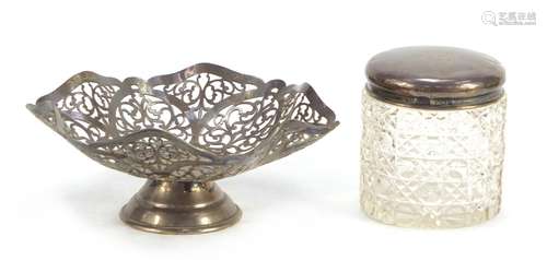 Pierced silver bon bon dish and a cut glass jar with silver lid, the largest 14.5cm in diameter :