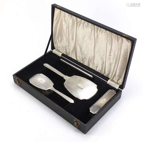 Sterling silver four piece dressing table set with engine turned decoration by WI Broadway & Co,