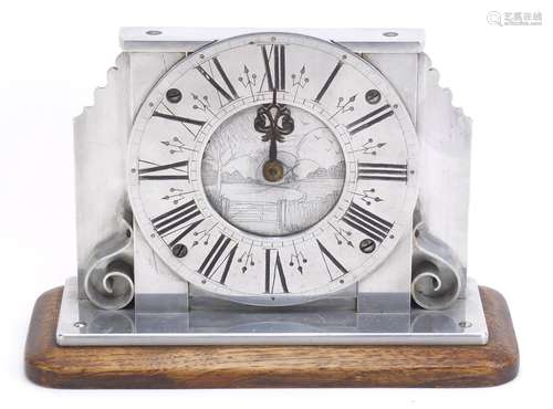 Silvered mantel clock having Roman numerals, engraved with a Dutch landscape, raised on an oak