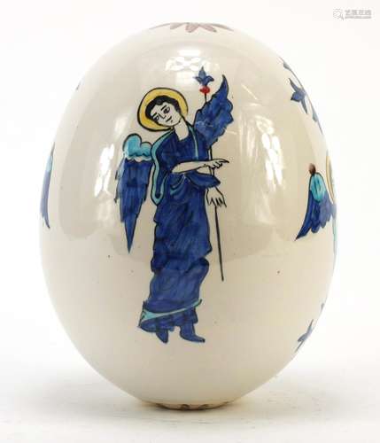 Turkish Armenian Kutahya pottery suspension egg hand painted with winged figures and masks, 18.5cm