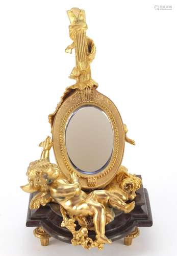 French Empire style gilt bronze table mirror in the form of putti with a mandolin, raised on a