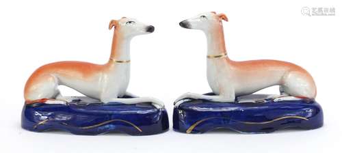 Pair of Staffordshire pottery greyhound pen stands, each 16cm wide : For Condition Reports Please