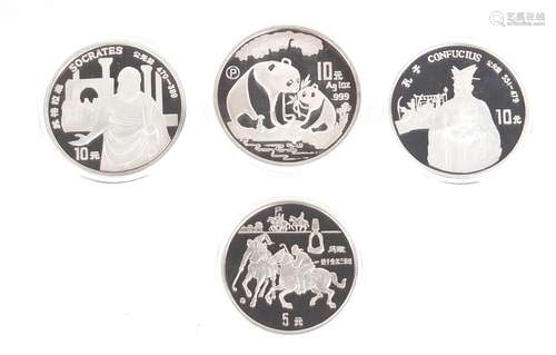 Four Chinese silver coins with certificates of authenticity including a 1993 silver panda and two